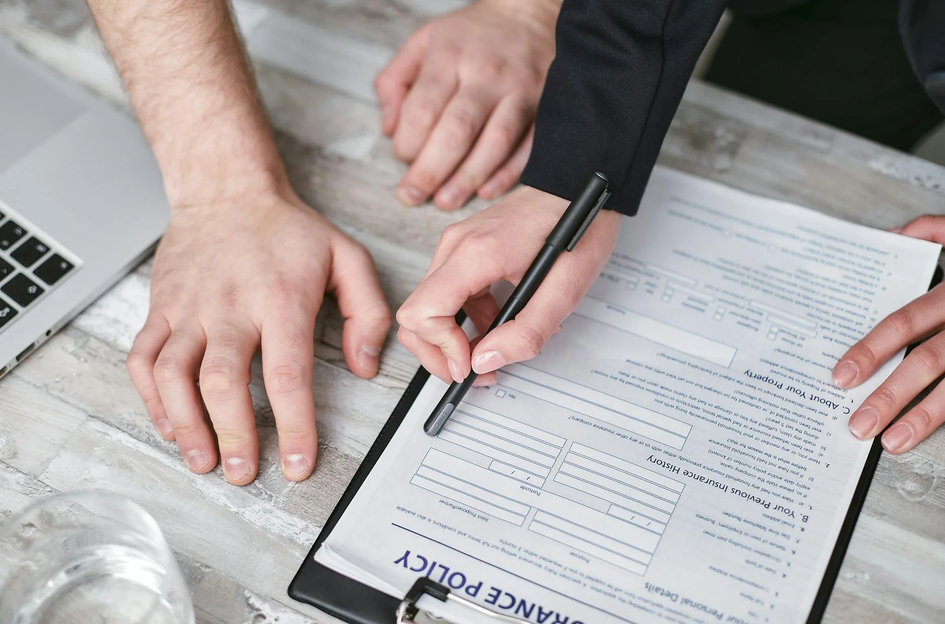 Couple signing a new private health insurance contract