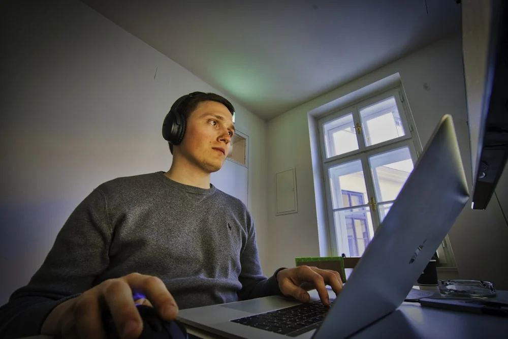 Person filing the Austrian tax return online on a laptop