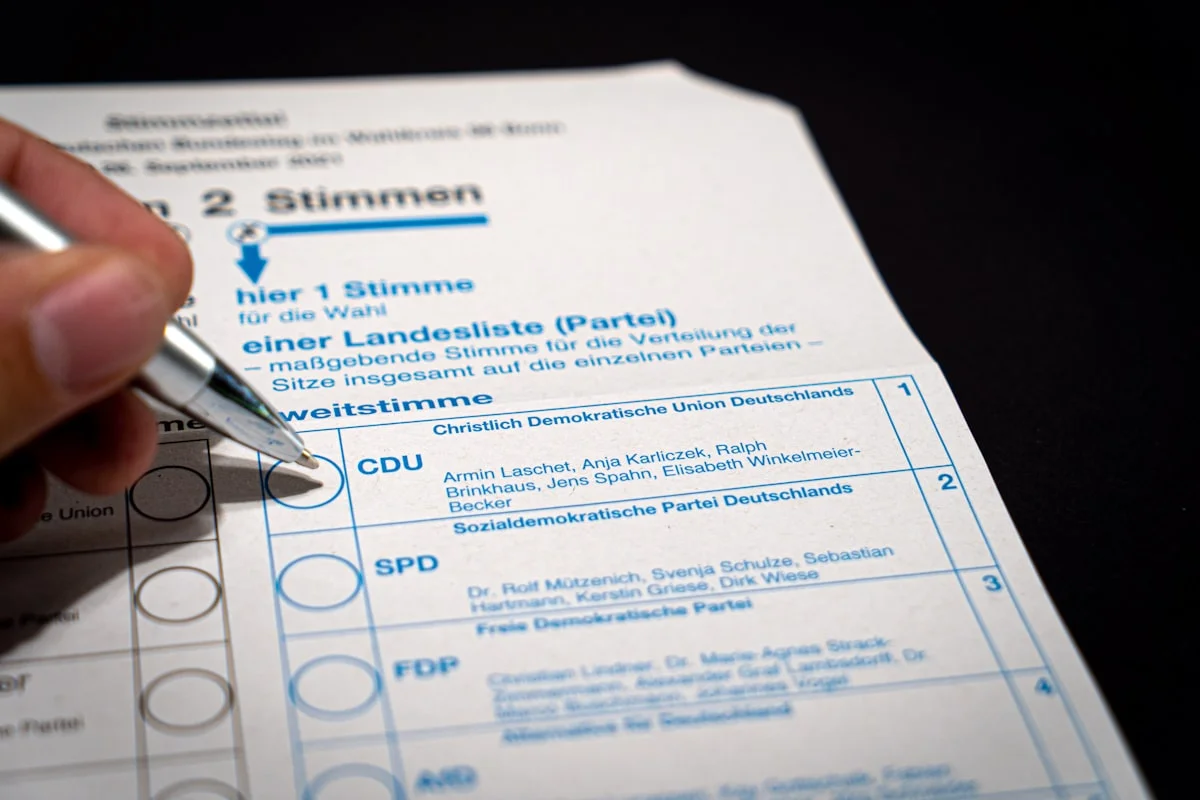 Tax return documents and pen on a desk in Austria